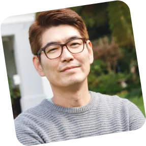 Man  in grey shirt smiling