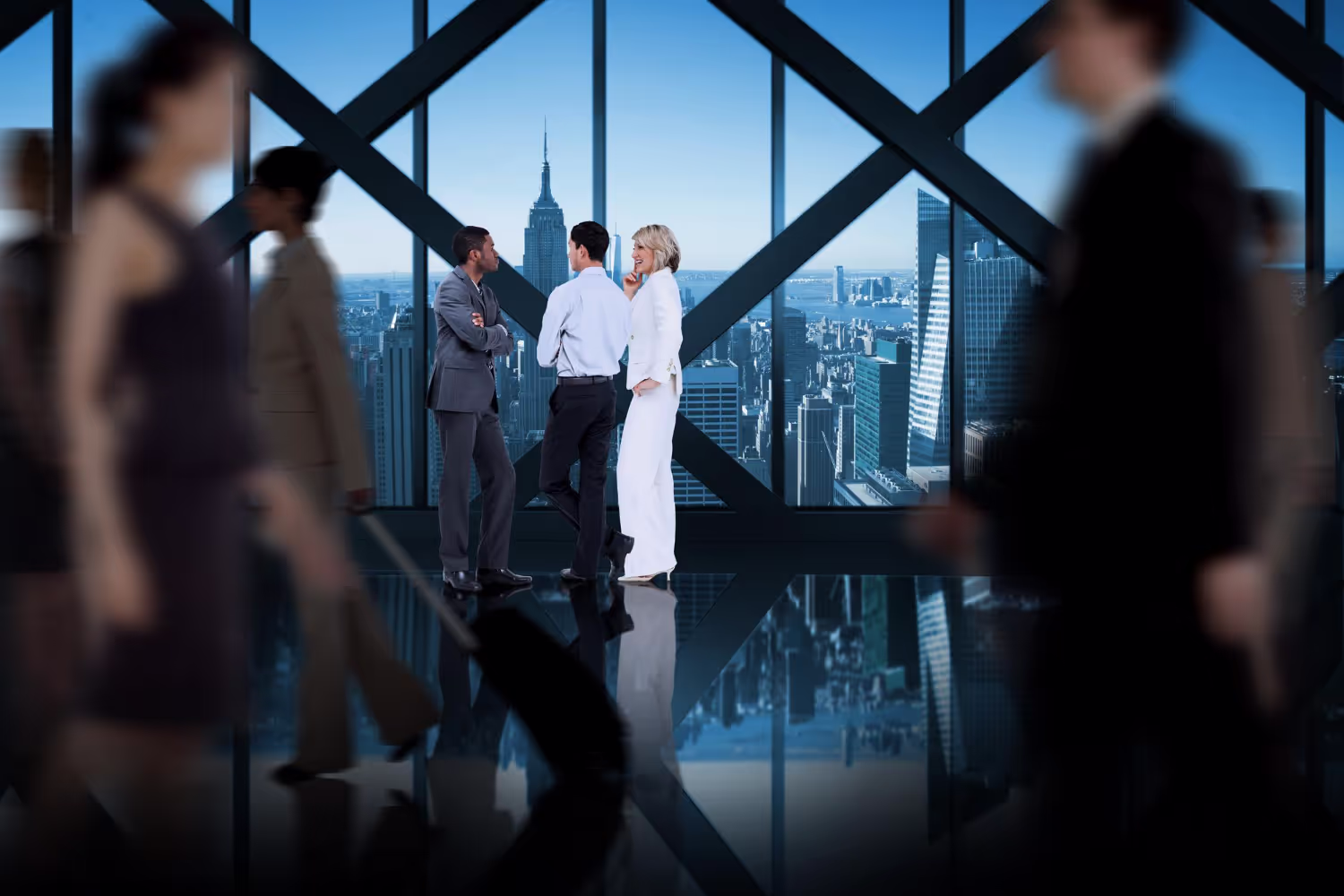 Colleagues meeting in a glass-walled office