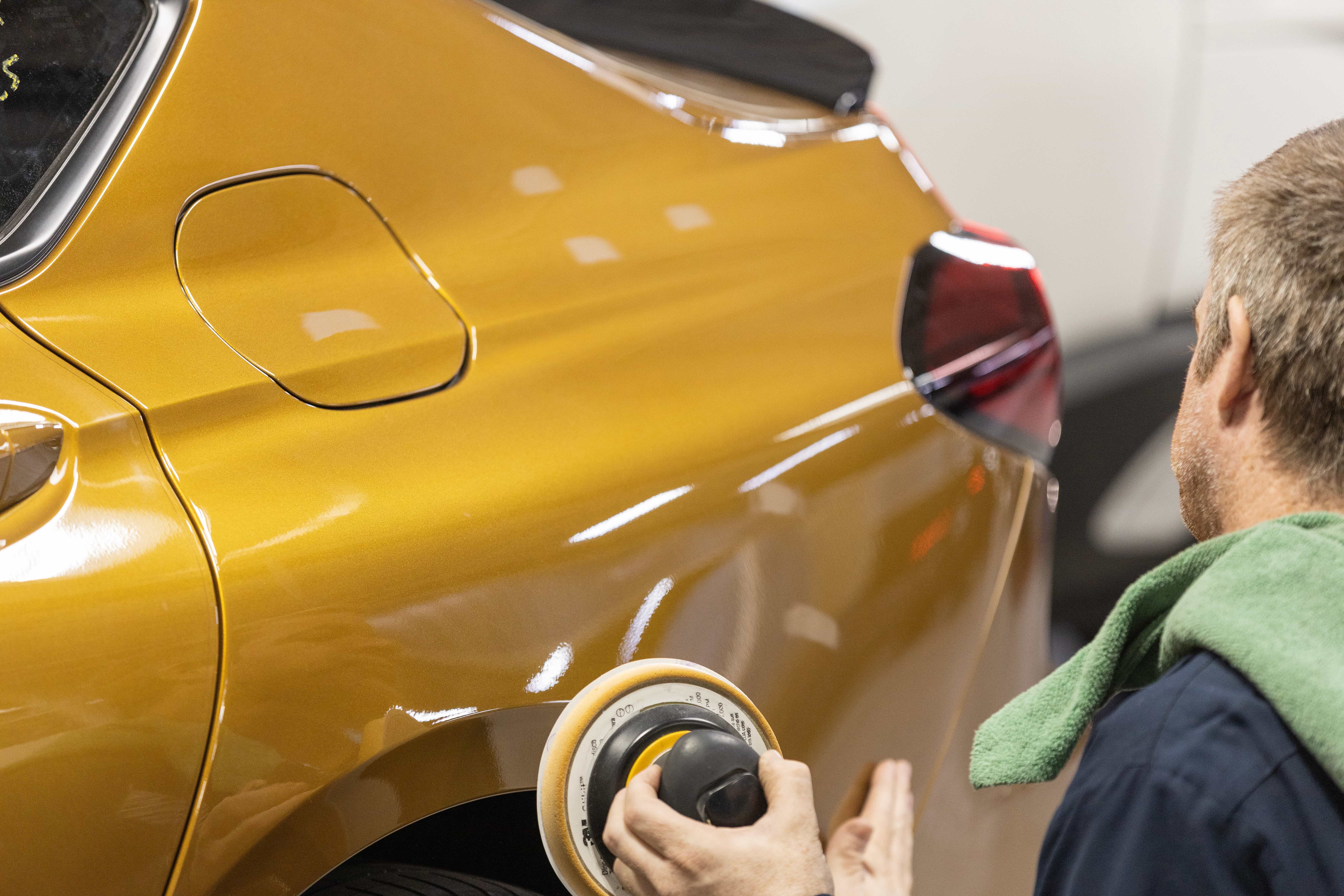 Someone repairing a car