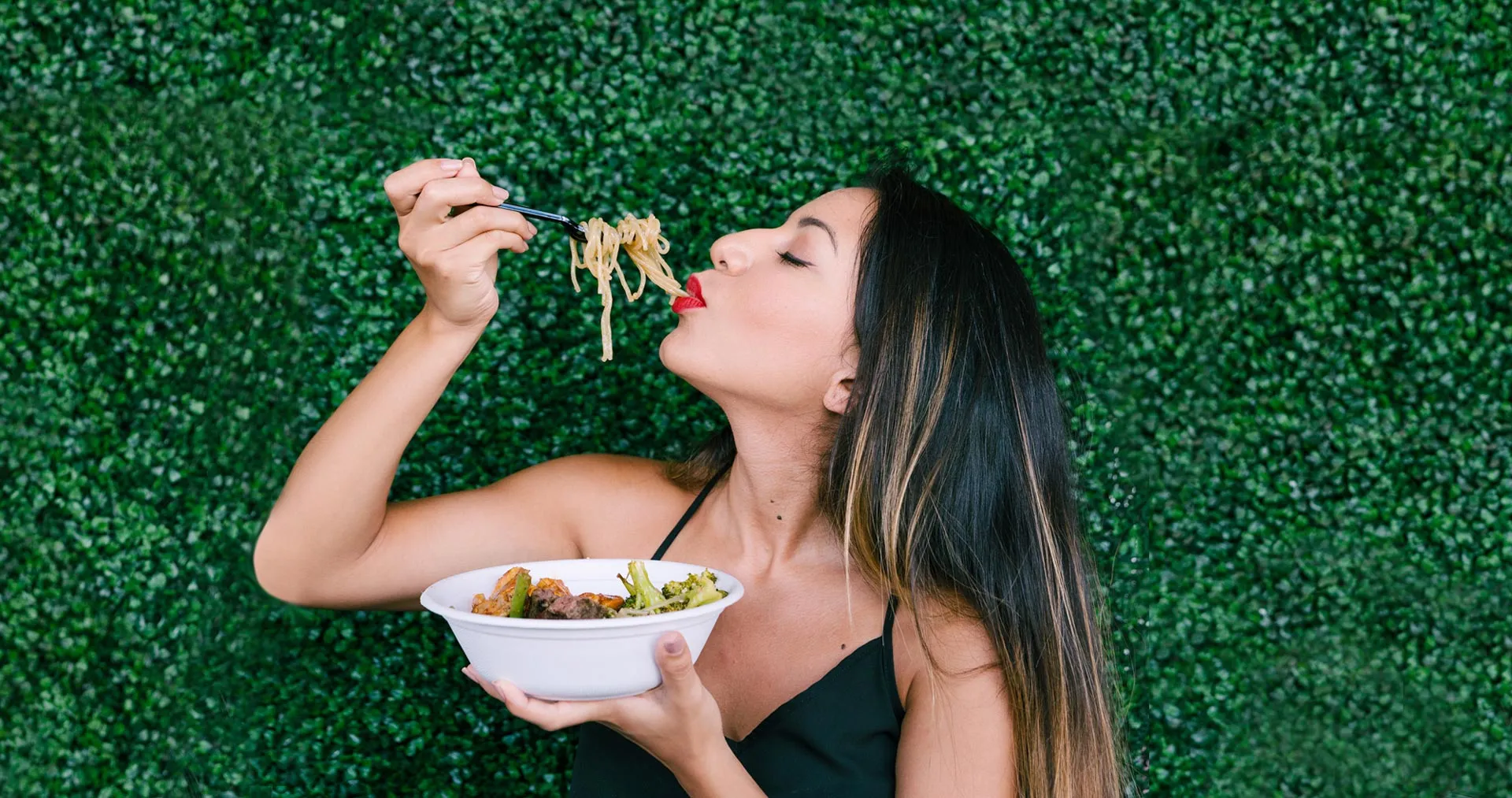 Woman eating noodles