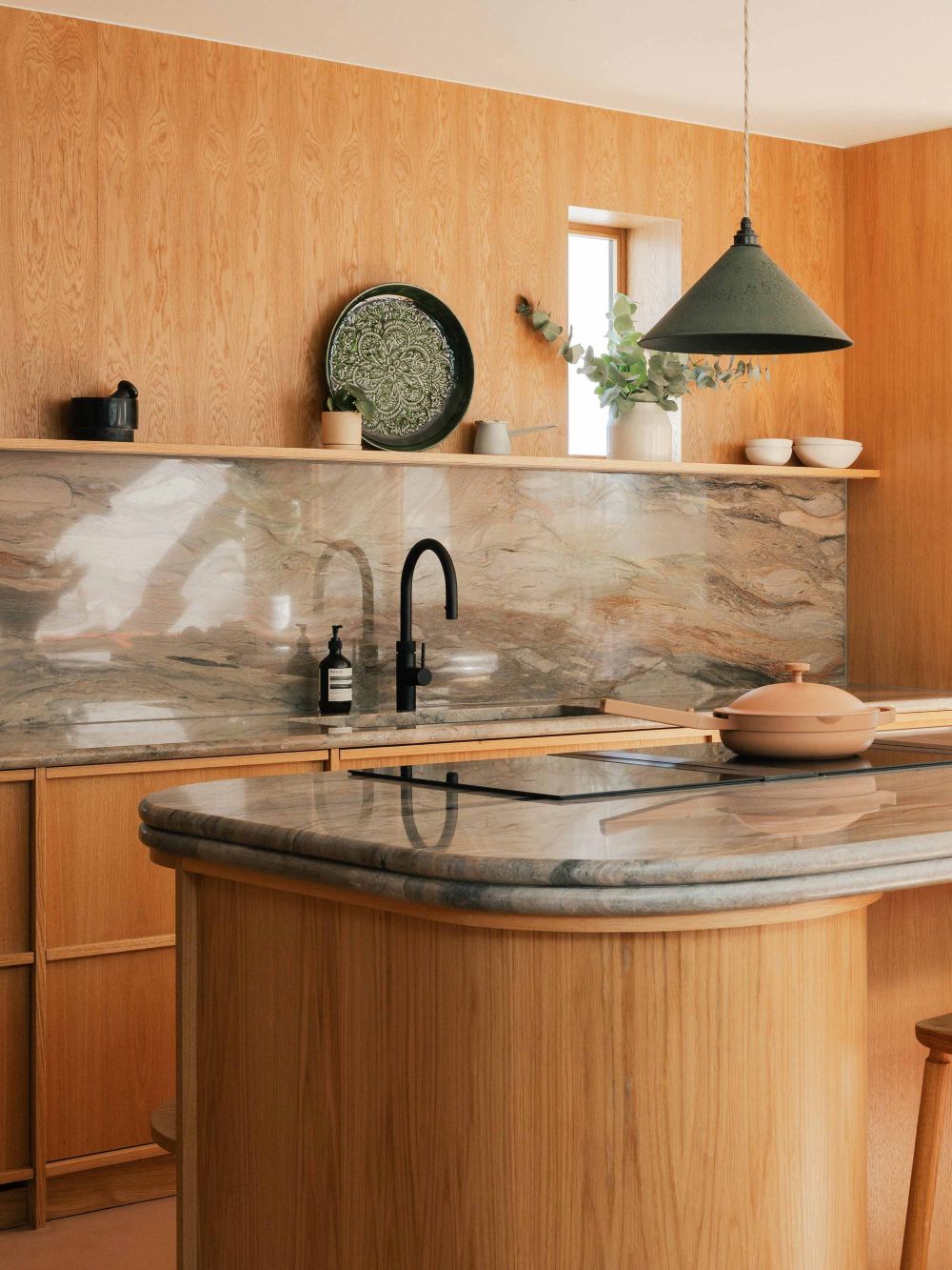 Wood kitchen renovation with island, marble worktops and open shelving in London by Benjamin Wilkes