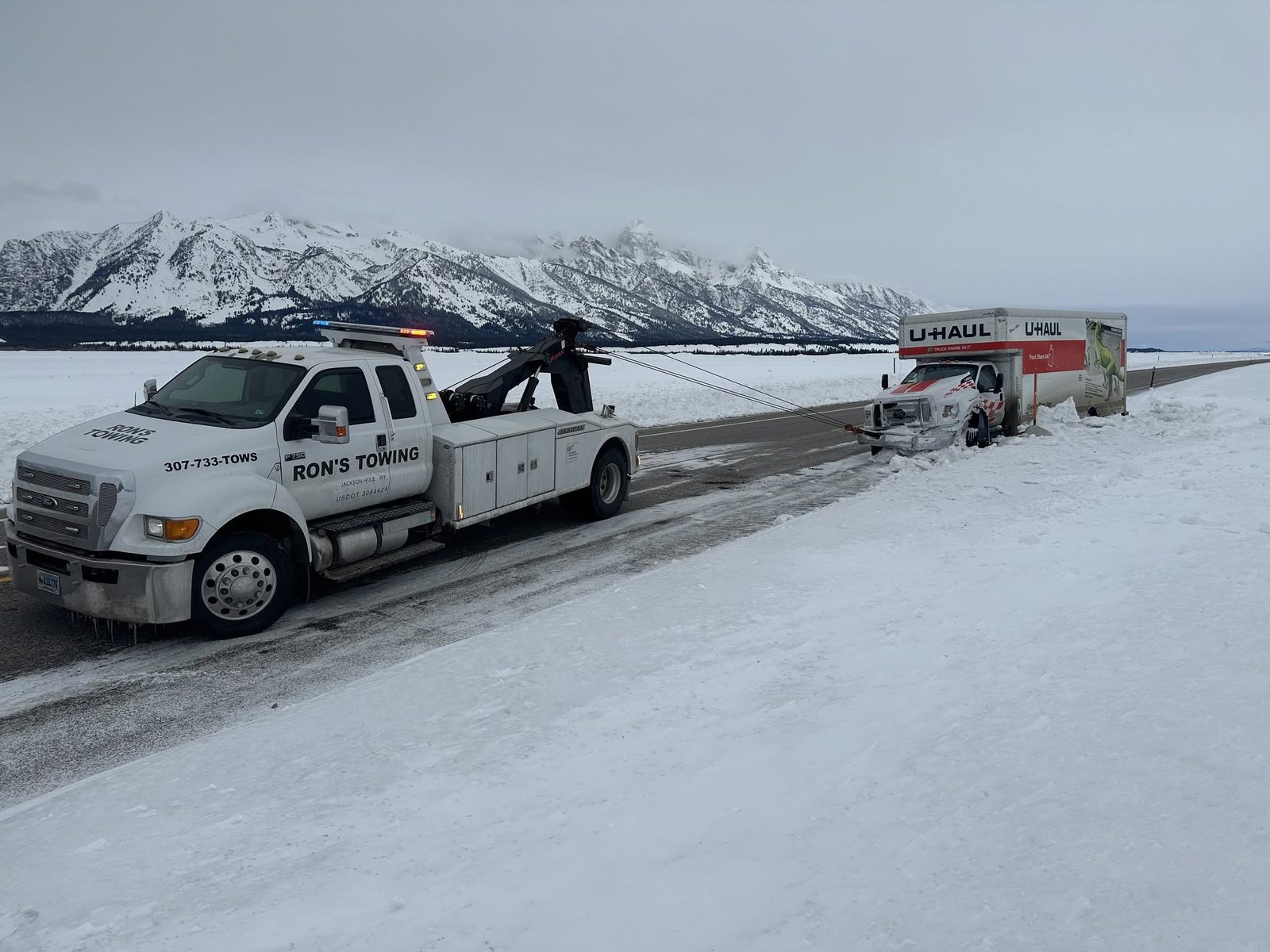 Trailer recovery on a snowy Teton Valley highway near Driggs, Idaho