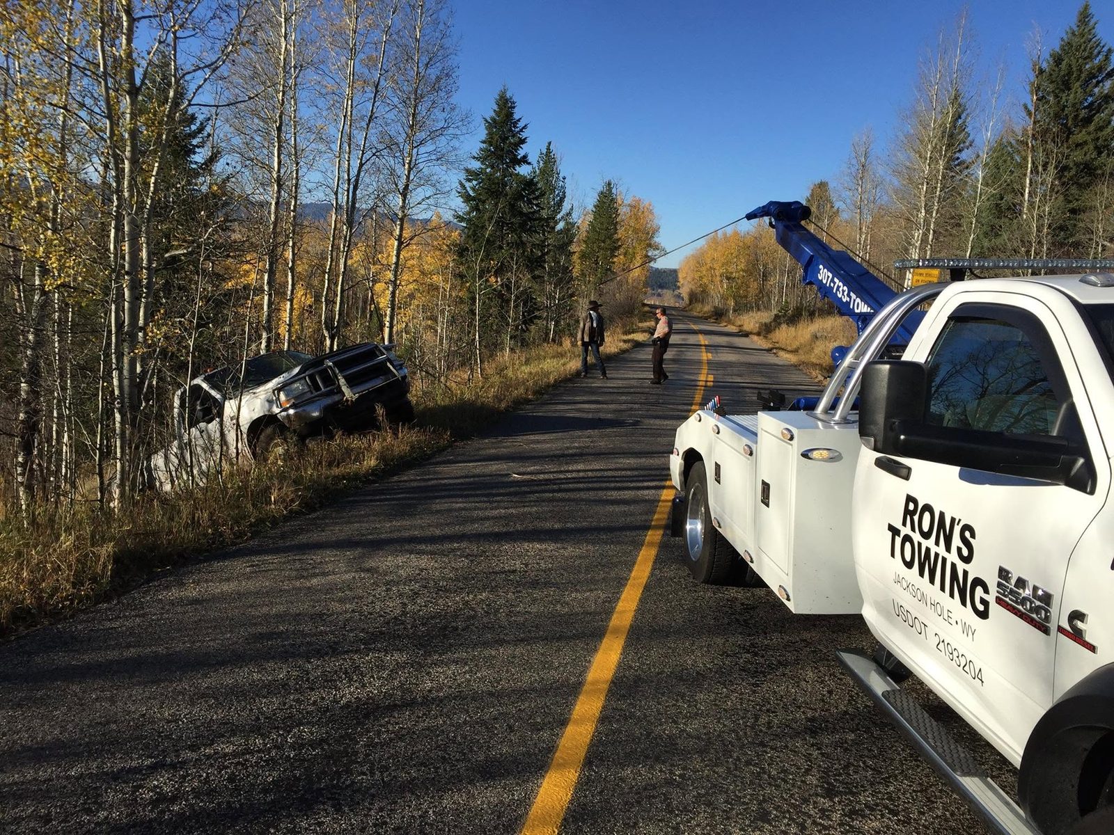 Canyon-road vehicle recovery in fall near Hoback Junction, Wyoming