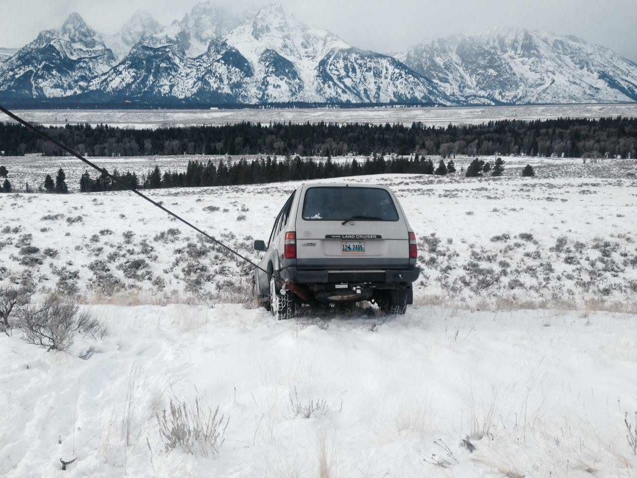 Winch-out recovery with the Teton Range behind near Moran, Wyoming