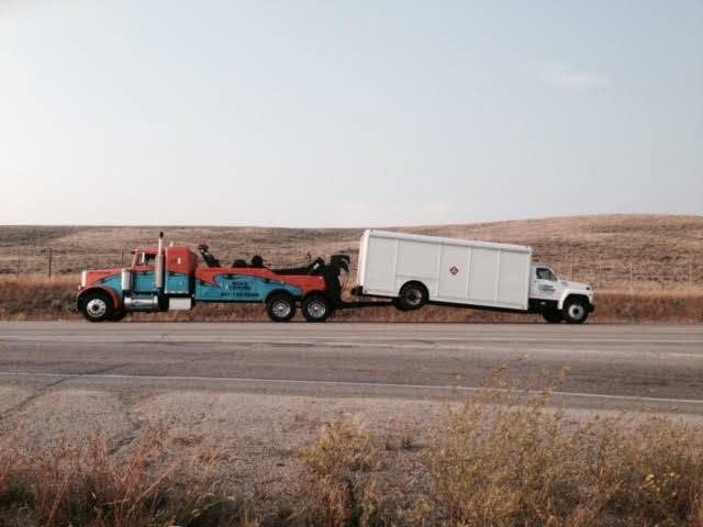 Heavy wrecker towing on the open highway in Star Valley, Wyoming