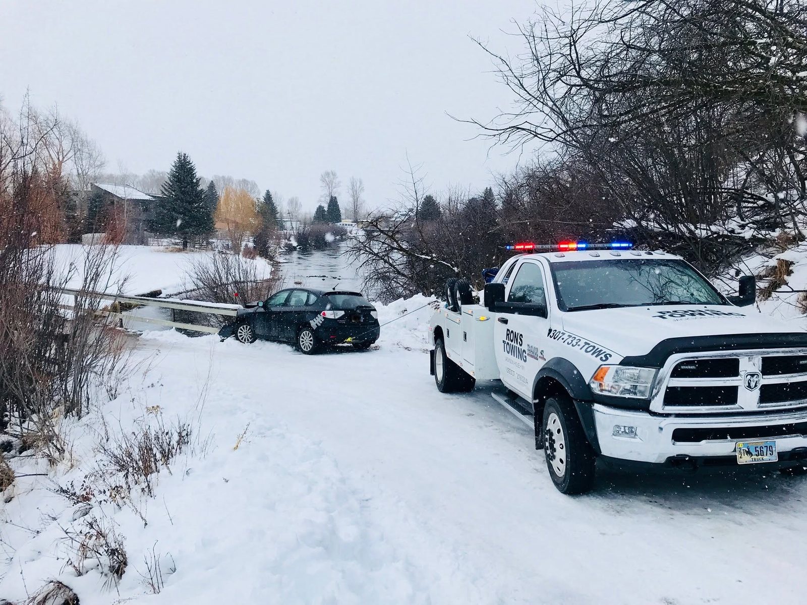 Winter tow of a car near Jackson Hole Airport by Ron's Towing