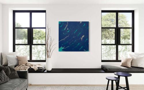 "A Sea of Blue" is a commissioned abstract painting that depicts the beauty of the ocean with a blend of midnight blue, turquoise, and white paint splatters. The painting has intricate details that give a calming effect, while the contrast between the colors adds vibrancy and depth. It's a stunning piece that can add sophistication and elegance to any room.