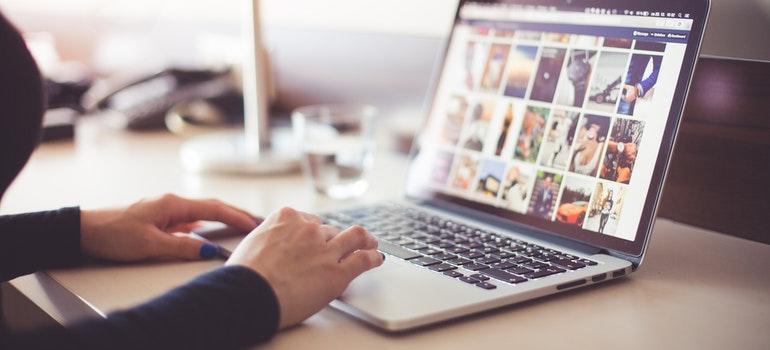 A person typing on a laptop