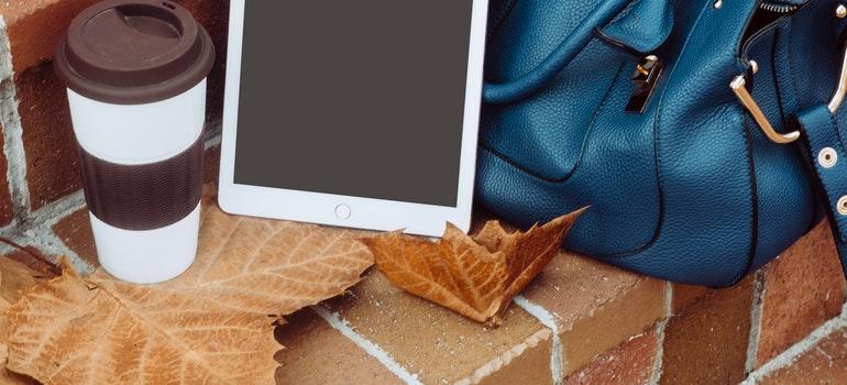Women bag and tablet on stairs