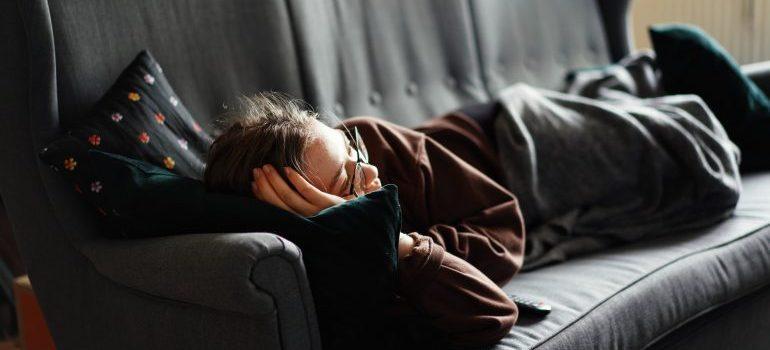 a woman lying on the couch - move from Palmdale to Beverly Hills in a week
