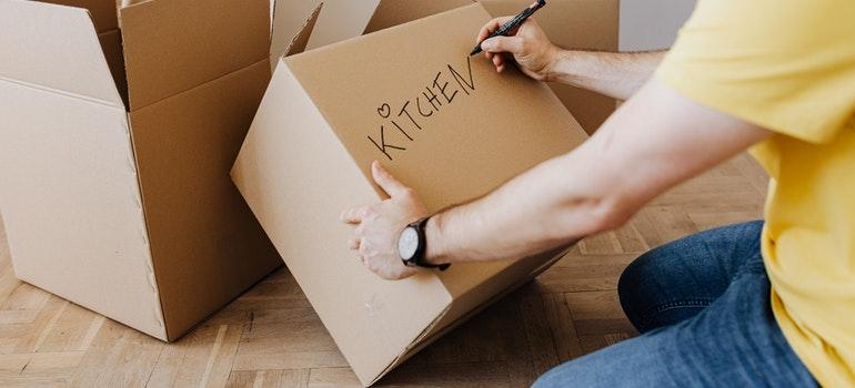 Man packing and moving bulky items