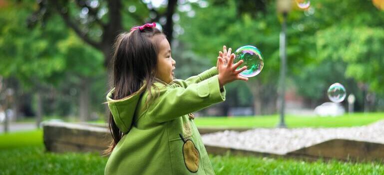 child playing in one of California suburbs for families