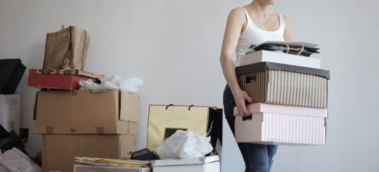 Woman carrying boxes