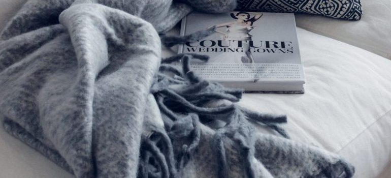 book and blanket on the sofa