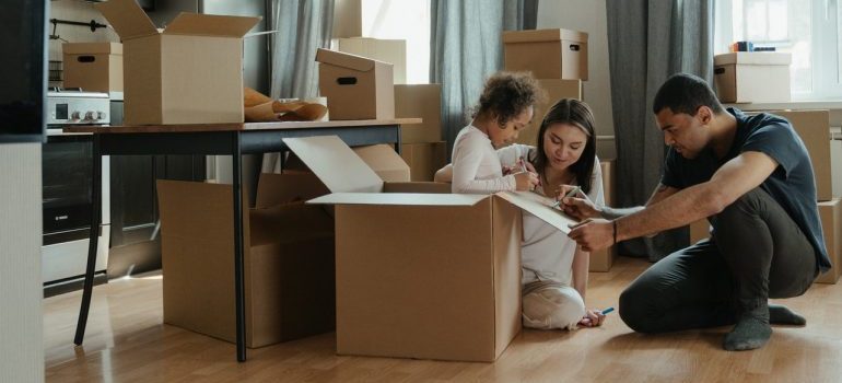 A family drawing on a cardboard box