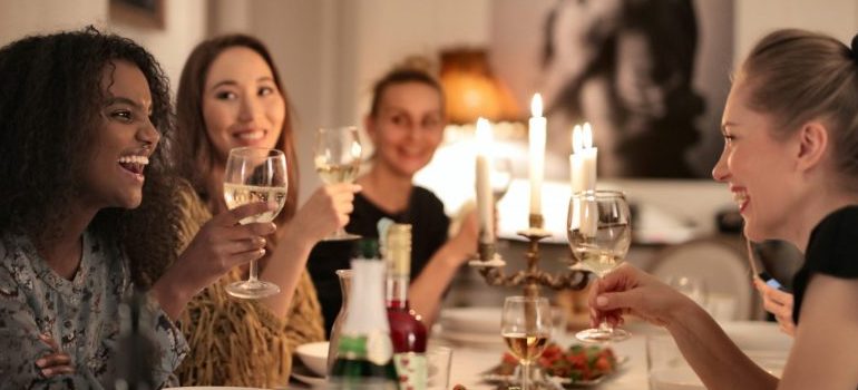 people at the restaurant, smiling, talking, drinking