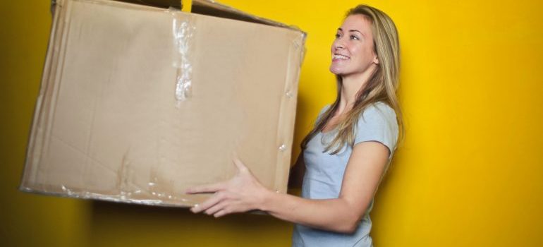 Picture of a woman carrying a box