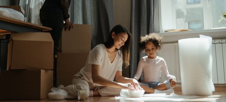 family packing items before the move
