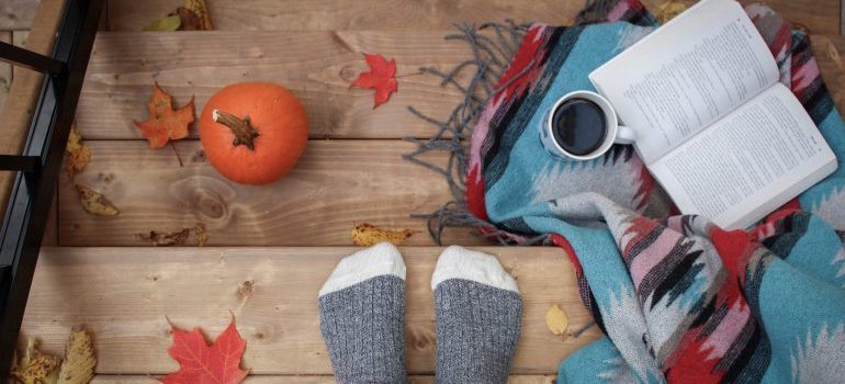 person sitting on porch in autum