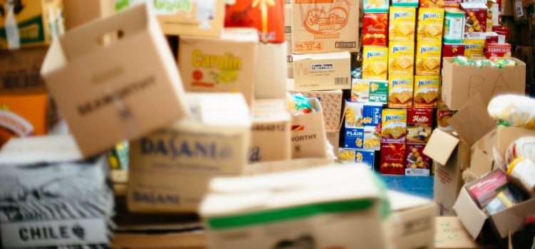 A pile of cardboard boxes that will help you protect your belongings from the rain