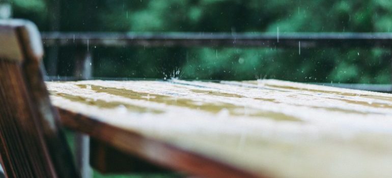 Rain pouring on an outdoor table