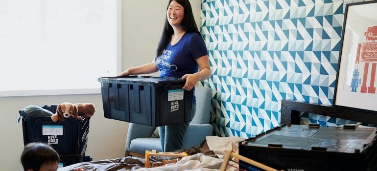 a woman and a boy packing