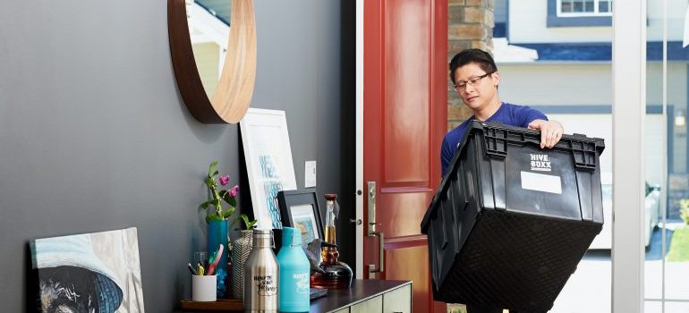 a man packing his home