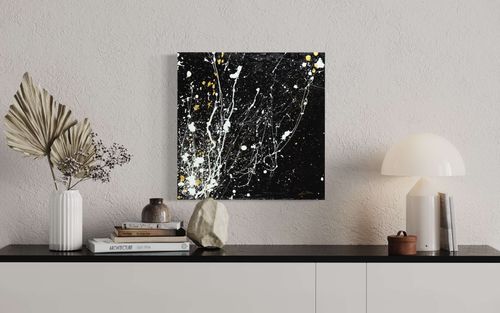'Supernova' is a captivating abstract painting featuring black, white, and gold acrylic paint splatters that create a dynamic composition resembling a powerful explosion of colors. This high-quality artwork is perfect for adding sophistication and creativity to any room, and its intricate layers offer new nuances with each gaze. Order now to own this unique and inspiring work of art.