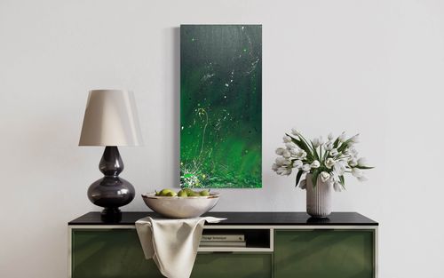 'What Lurks Beneath the Grass' is a captivating abstract painting that showcases the vitality of nature through shades of green and splatters of white and yellow. The textured bottom of the canvas suggests hidden mysteries and movement.
