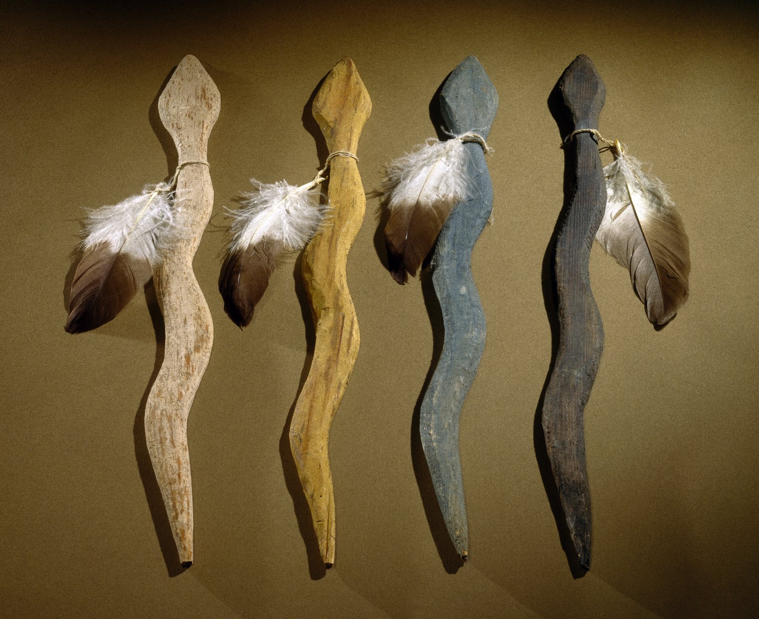 Navajo wooden snakes with feathers, the black wind of the east, the blue wind of the south, the yellow wind of the west, and the white wind of the north