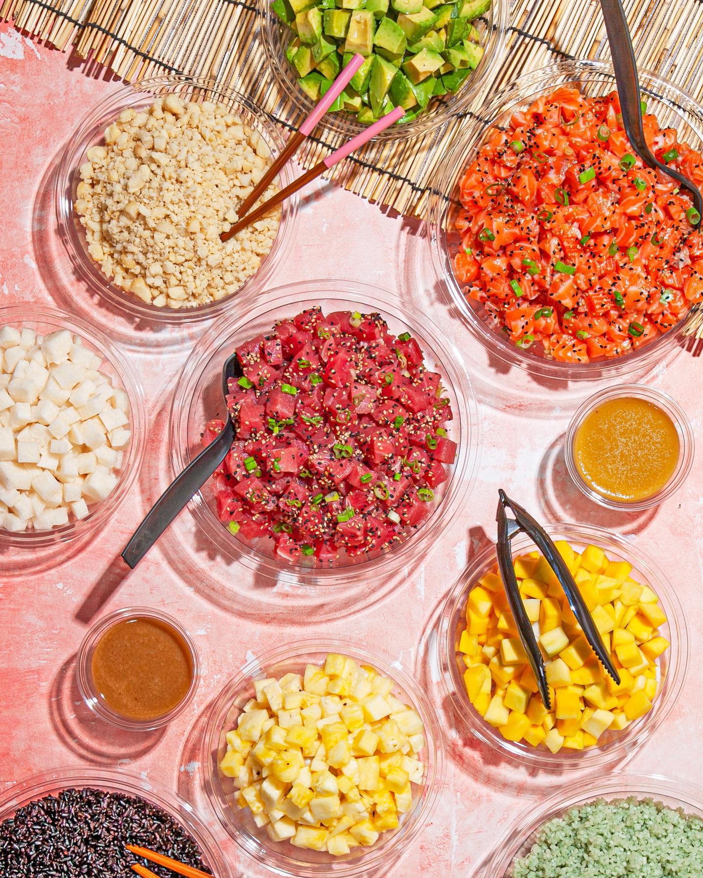  A Sweetfin Poke bowl and sides placed on a table. 