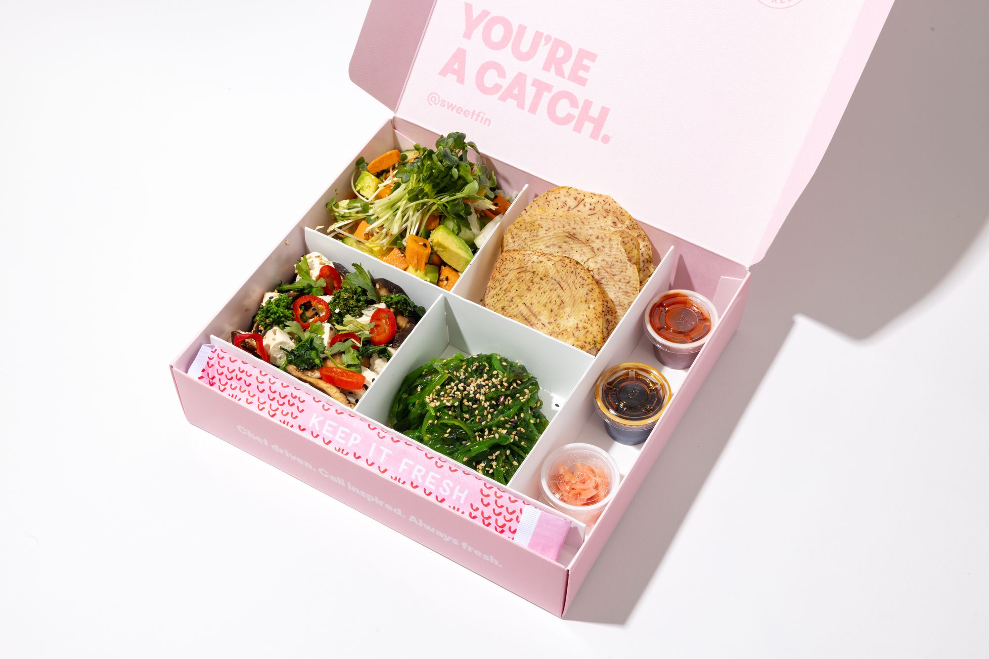 The signature Sweetfin Plant-Based Sweetbox with chili tofu, sweet potato, and seaweed salad.