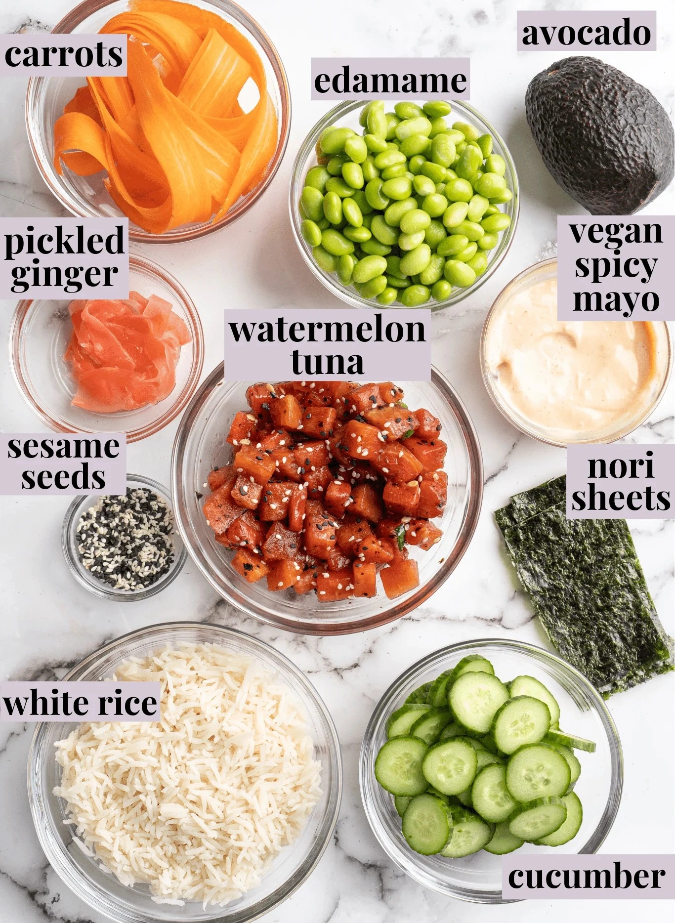 Sweetfin poke bowl ingredients featuring watermelon tuna, edamame, avocado, carrots, cucumber, white rice, sesame seeds, and vegan spicy mayo toppings.