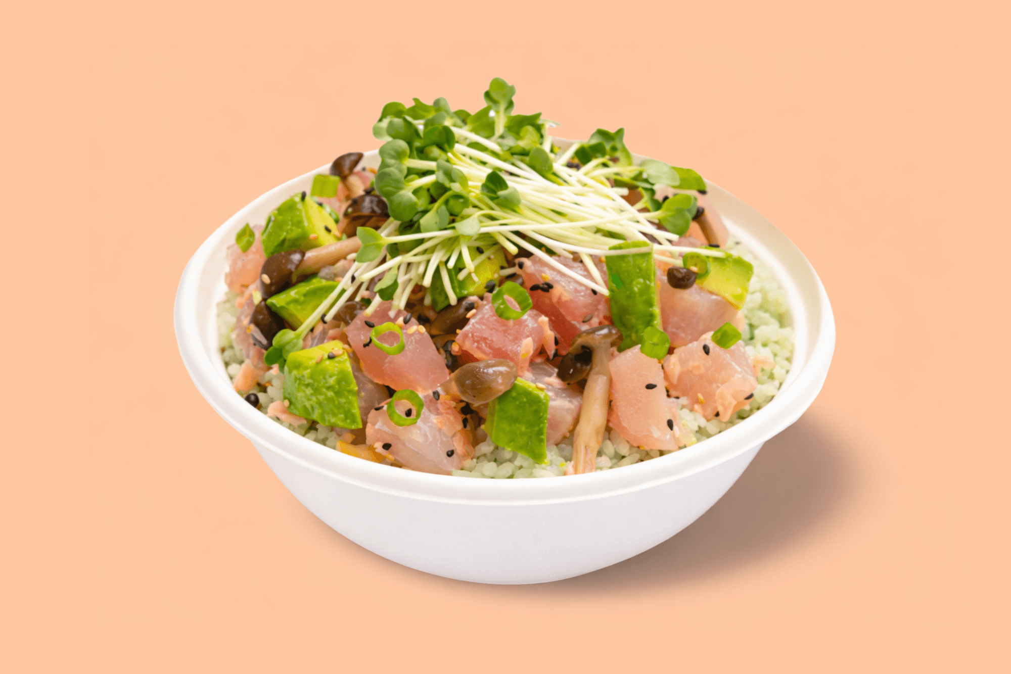 Sweetfin poke bowl with fresh fish, avocado, mushrooms, microgreens, sesame seeds, and rice on a peach background.