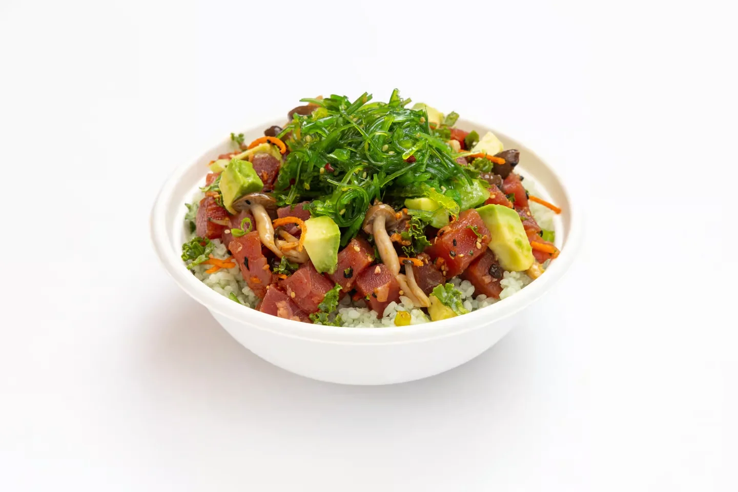 Sweetfin poke bowl with tuna, avocado, mushrooms, seaweed, and fresh toppings over rice.