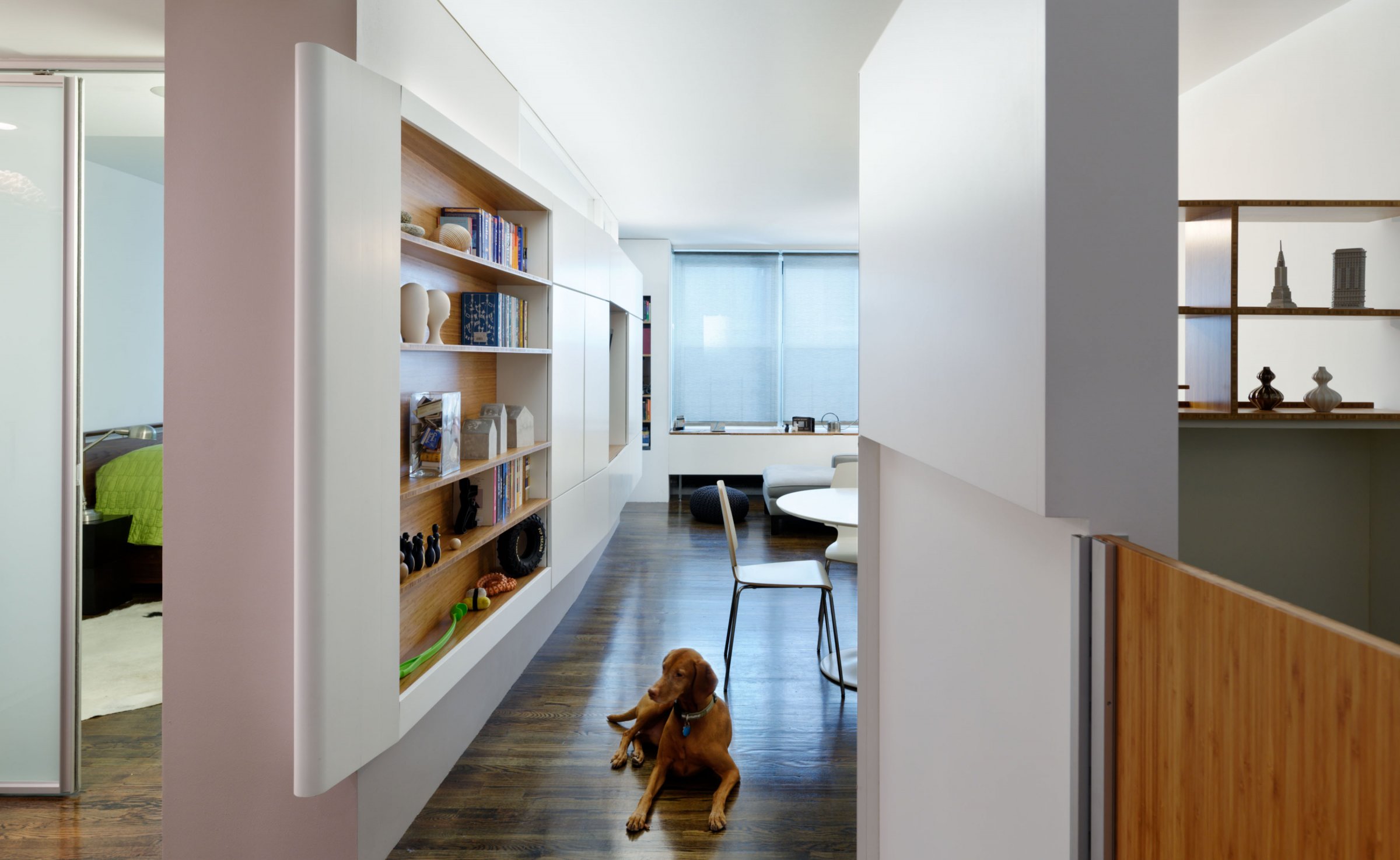 From the entryway, the prow of the 'Flatiron' is the dominant element. To the right, the 'Cloud‑Catcher' sleeping pod for the child can open and close to keep Diego at bay