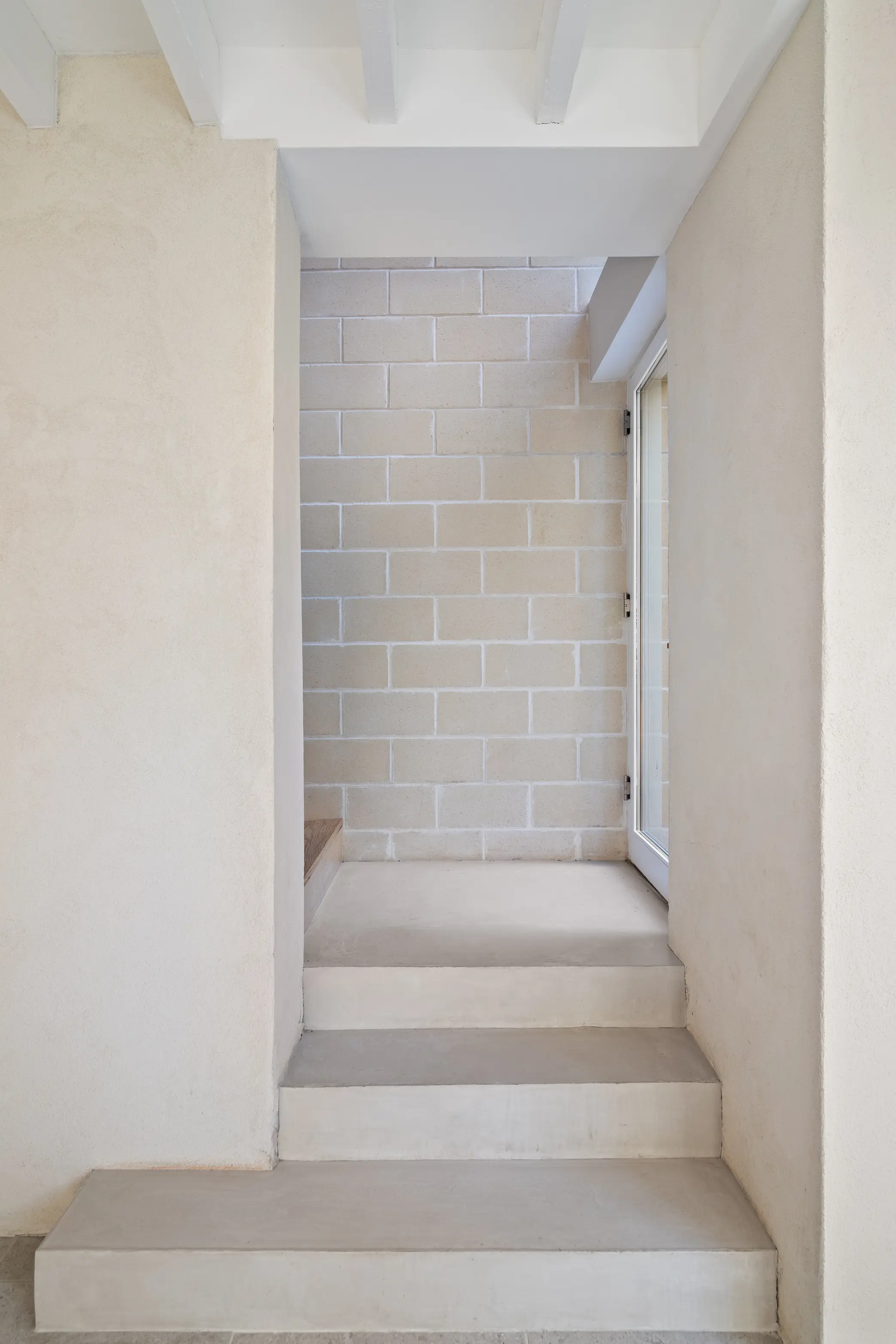 Skinny Leonard circular stair with skylight