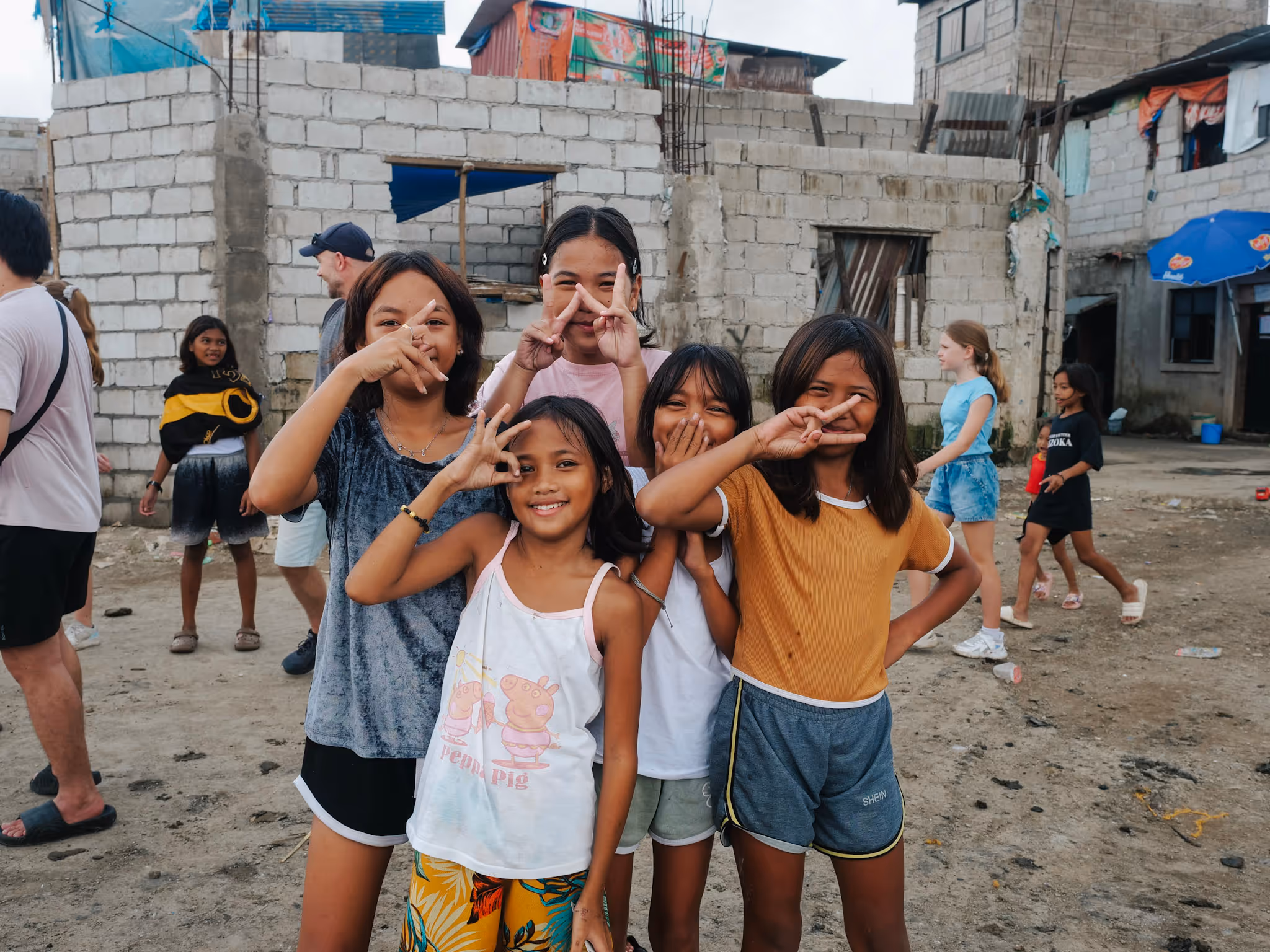 Four different hand signs and one just couldn't contain her smile.