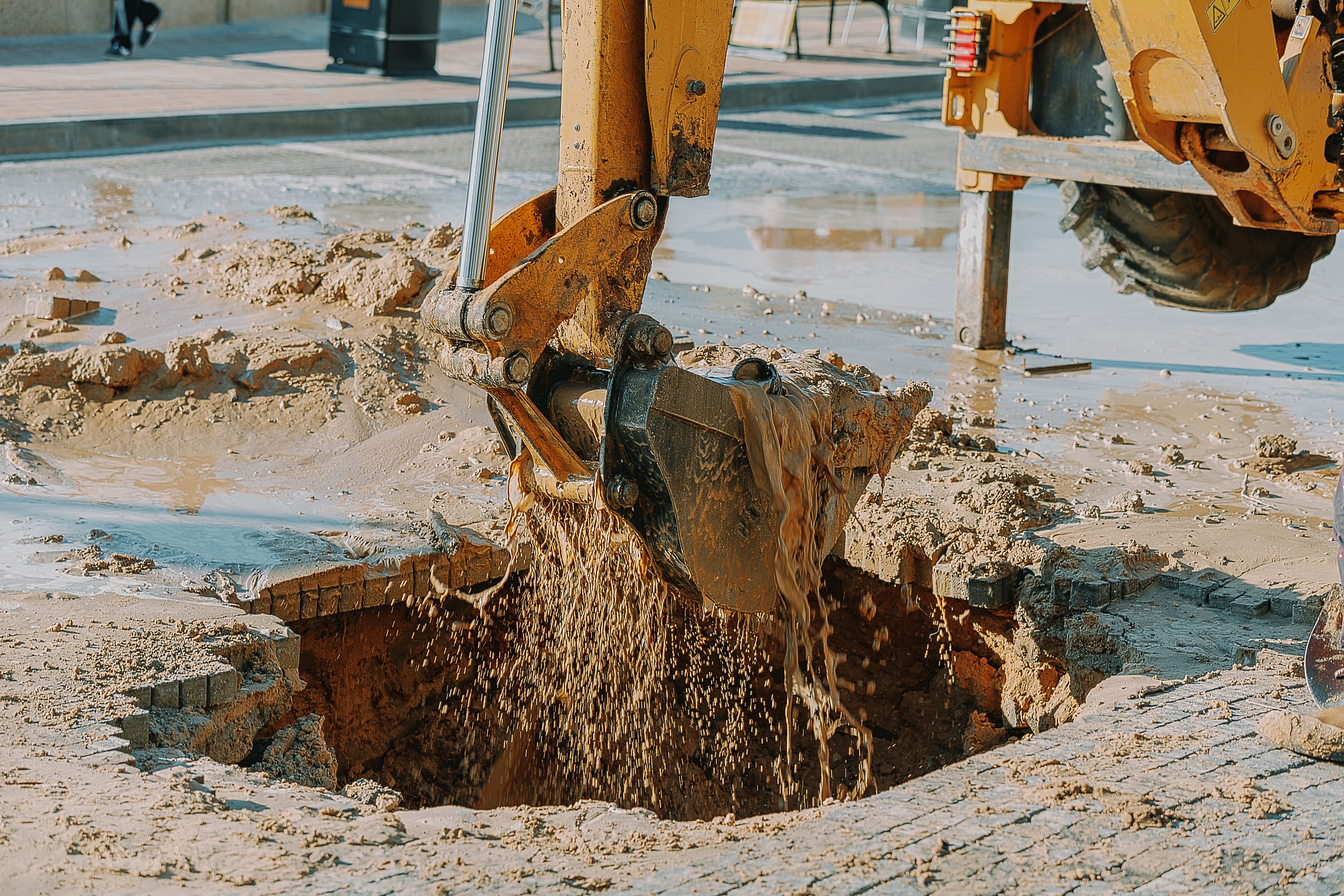 Scooping water using heavy machinery 