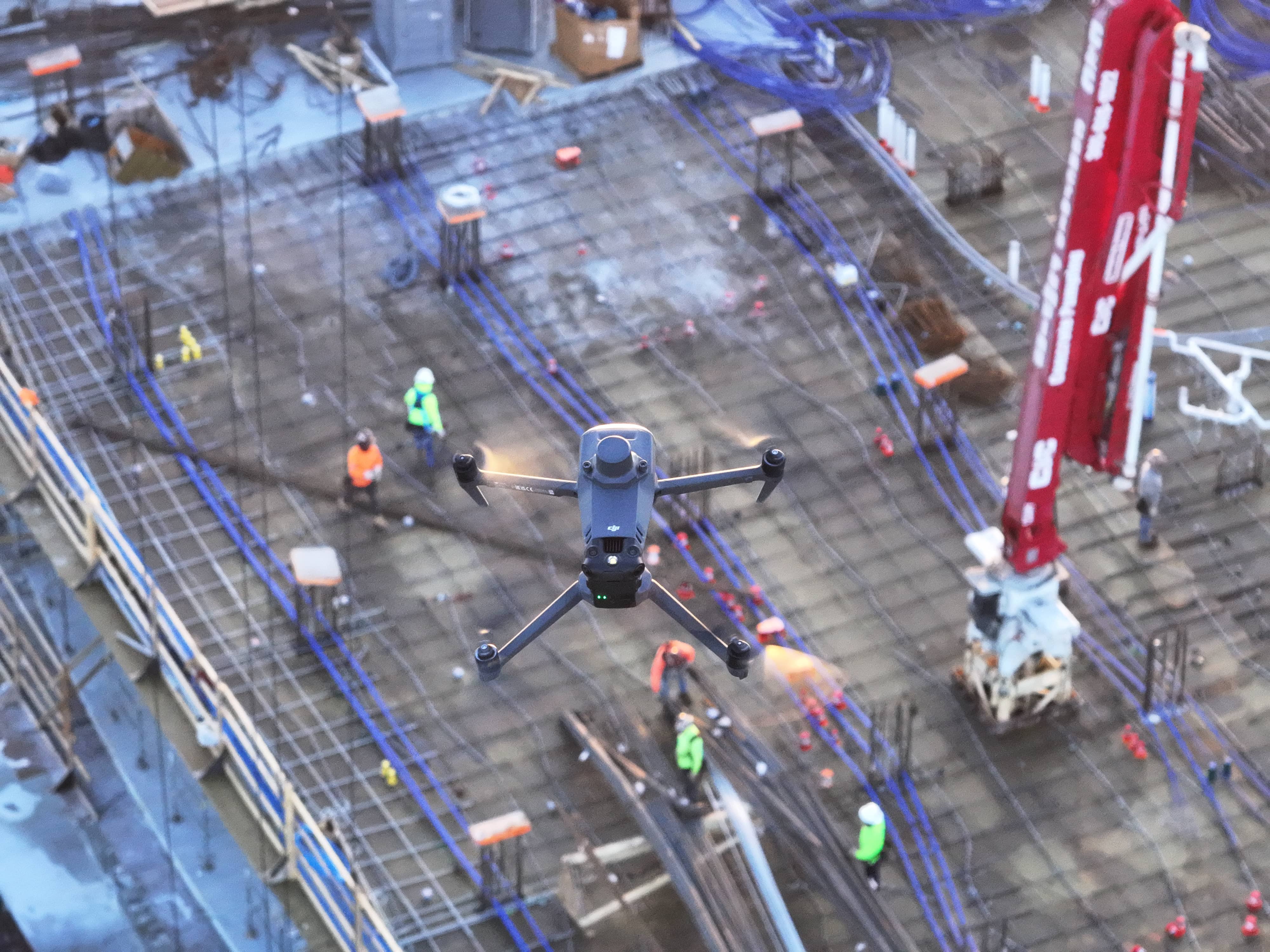 drone flying over a construction site