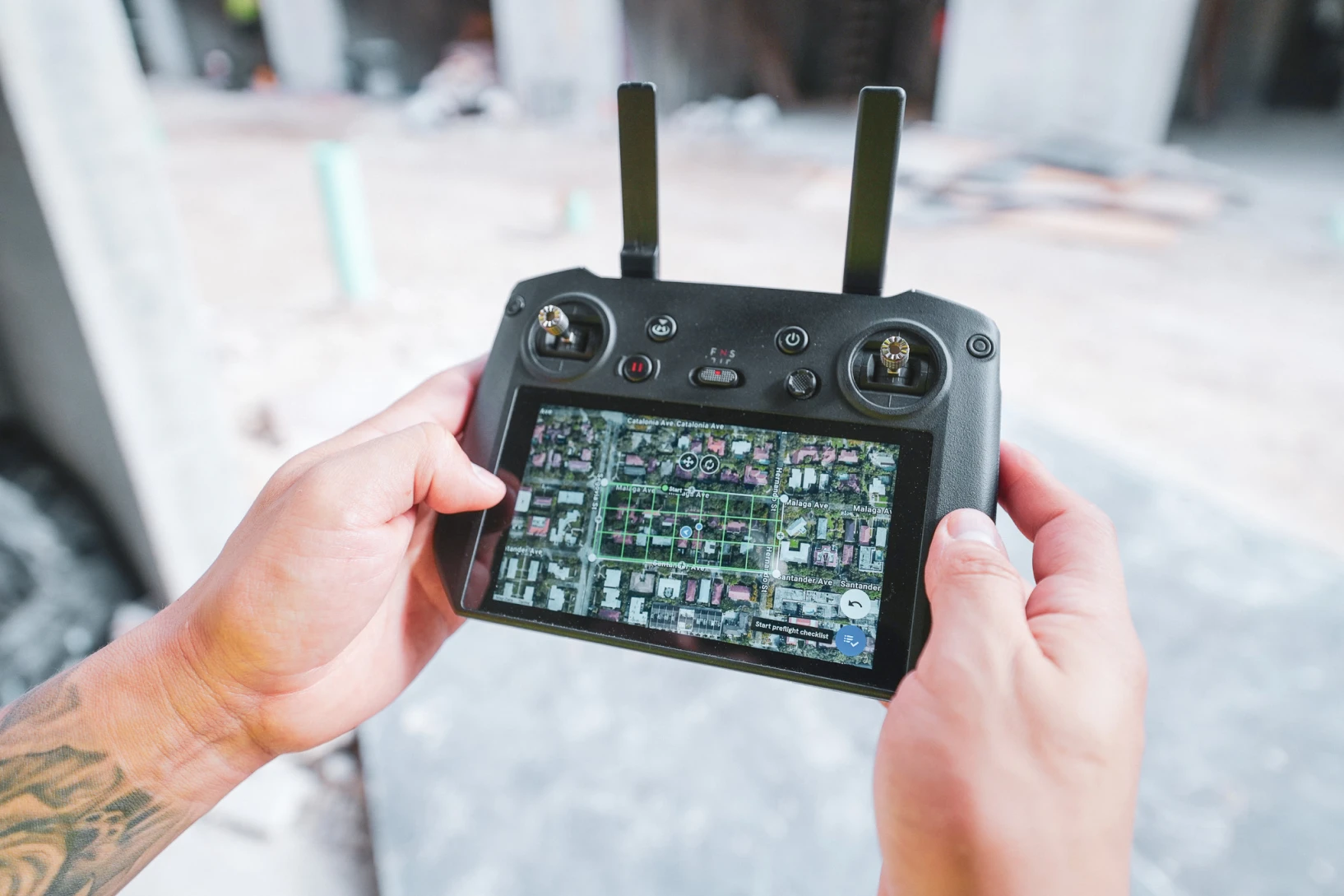 Over the shoulder look of someone using a drone controller