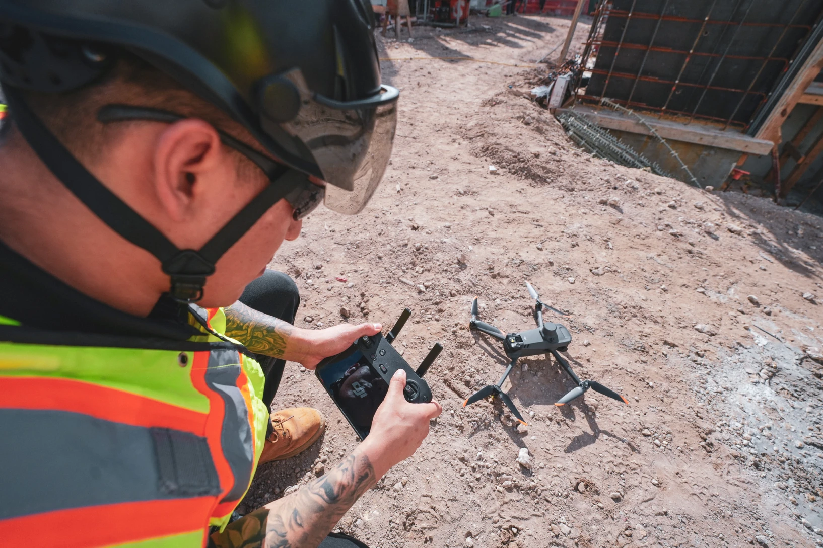 builder piloting a drone