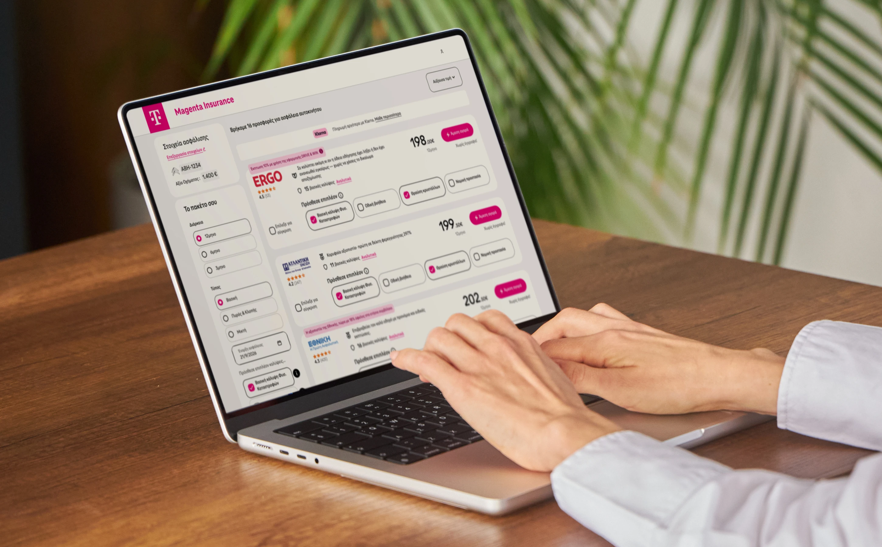 Person using laptop showing the Magenta Insurance website