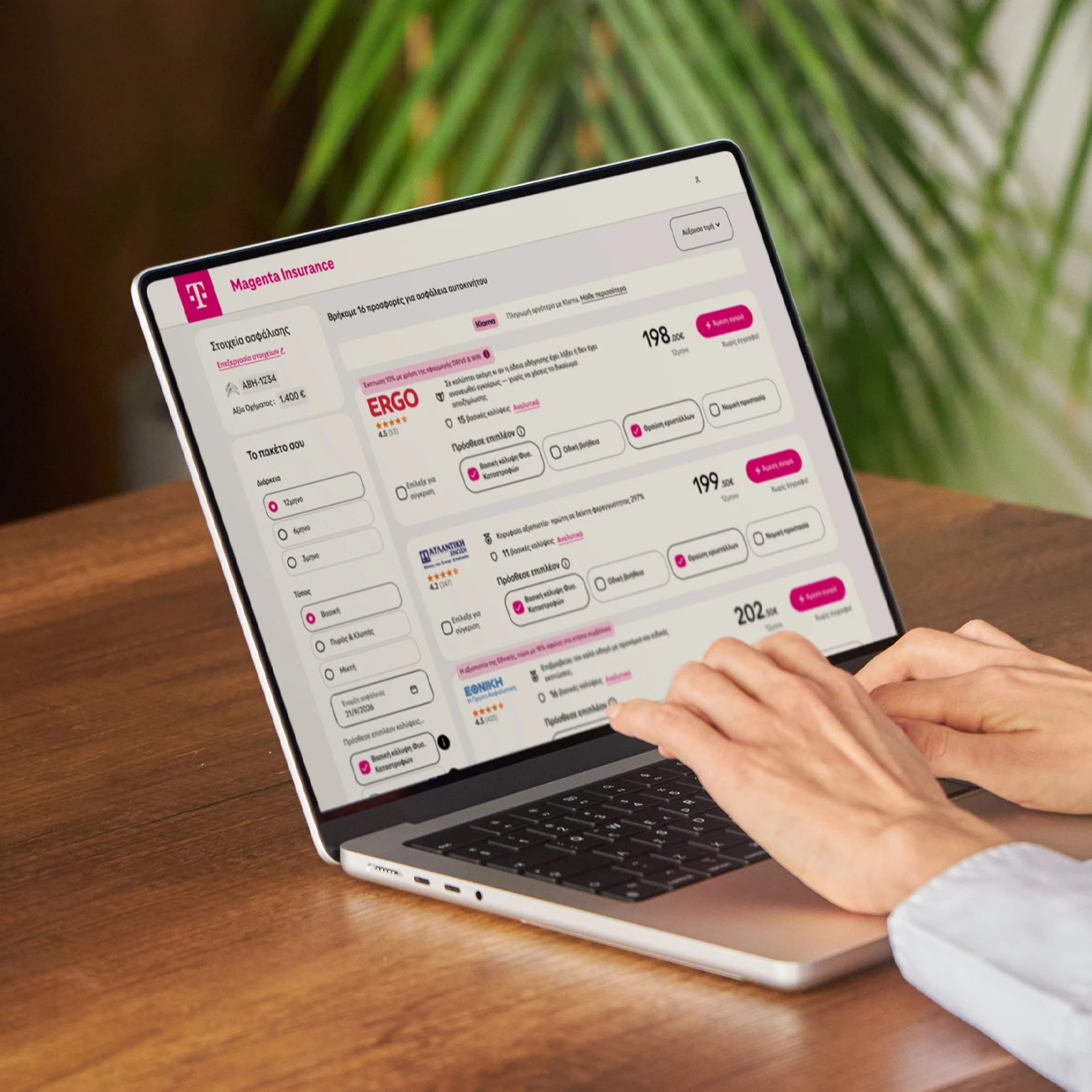Person using laptop showing the Magenta Insurance website