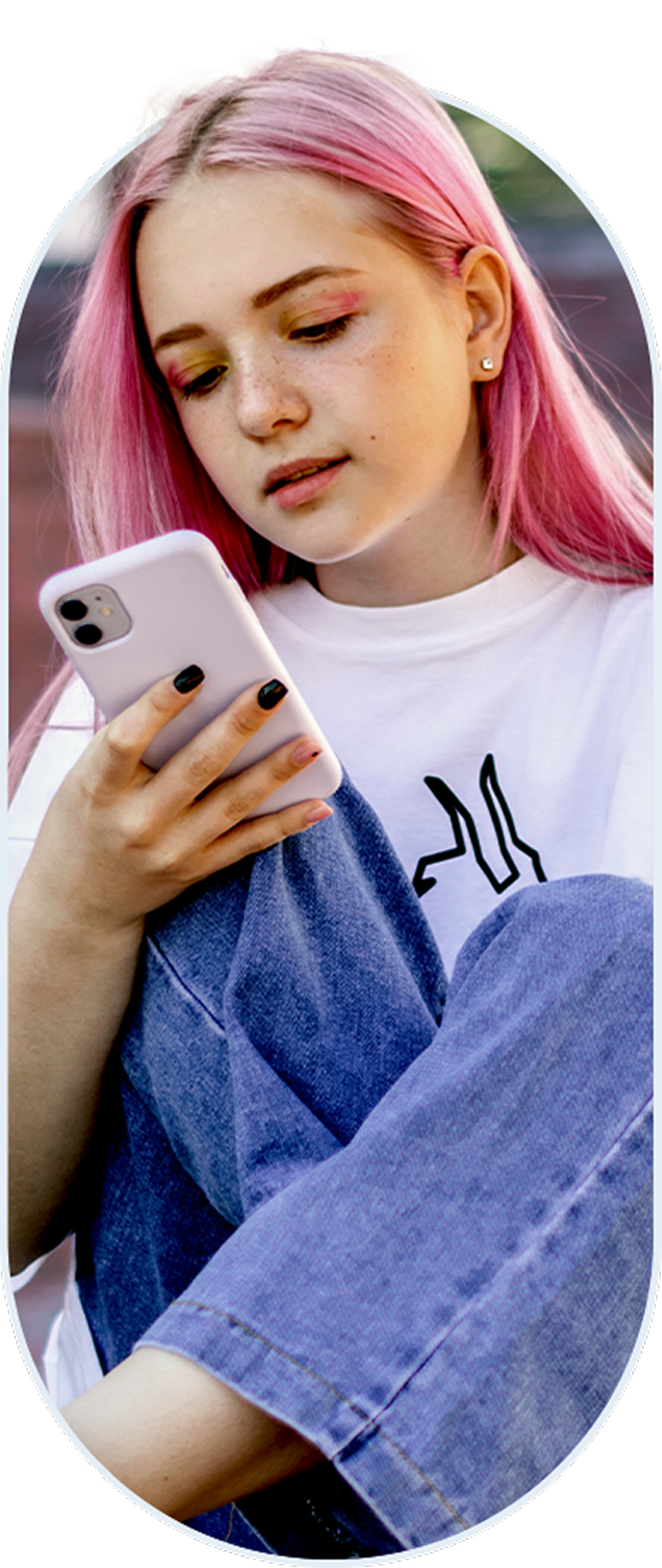 Young woman and looking at her smartphone.
