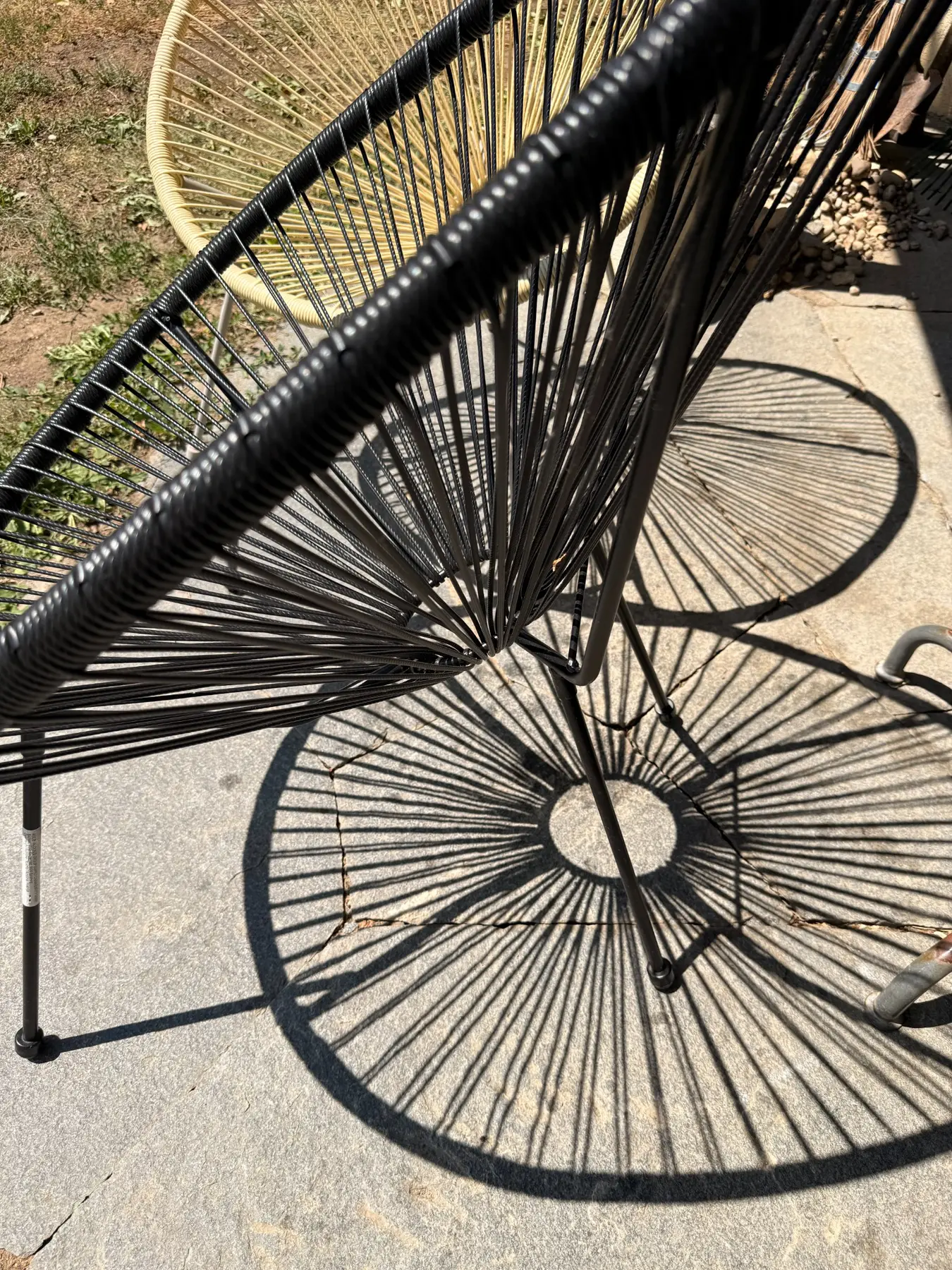 Graphic shadows cast by woven chairs