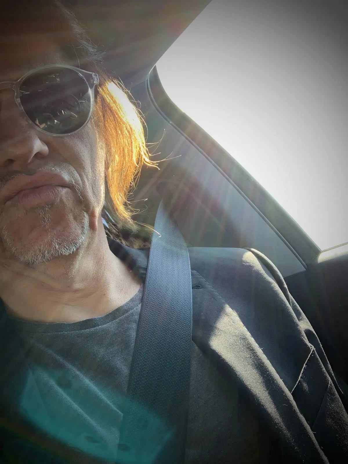 Sunlit portrait inside a car