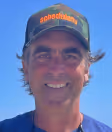 A Weston Aiken picture. He's smiling at the camera happily, wearing a camo hat. 
