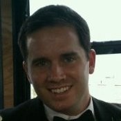 Mike Rosenello picture. He's wearing suit and a bow tie, smiling happily at the camera.