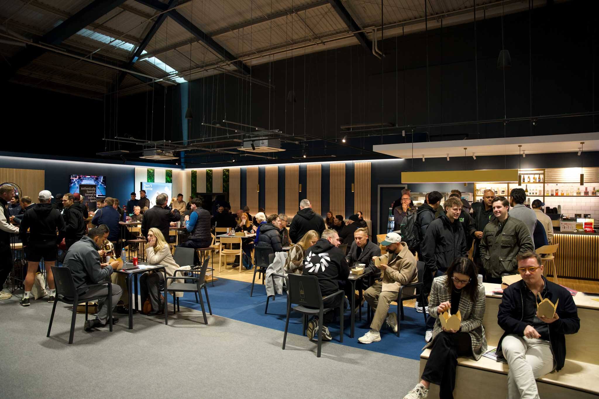 Padel convention attendees enjoying a break eating paella